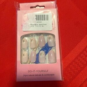 Manicure medium length pale pink press on nails with gold glitter dot on top